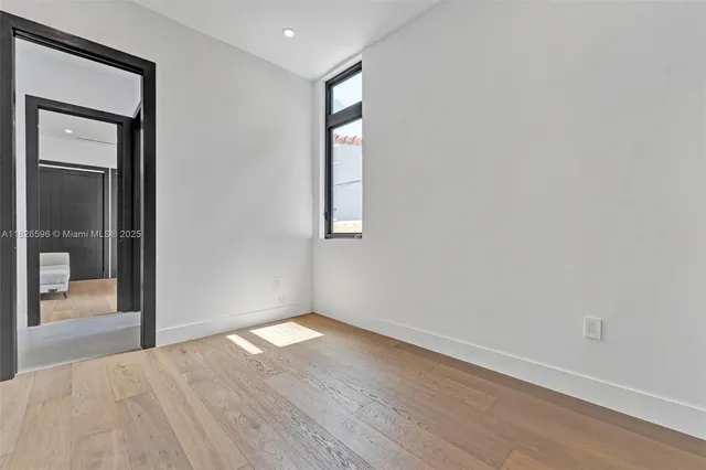 an aerial view of a house with a garden and swimming pool