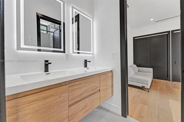 an aerial view of residential houses with outdoor space and street view