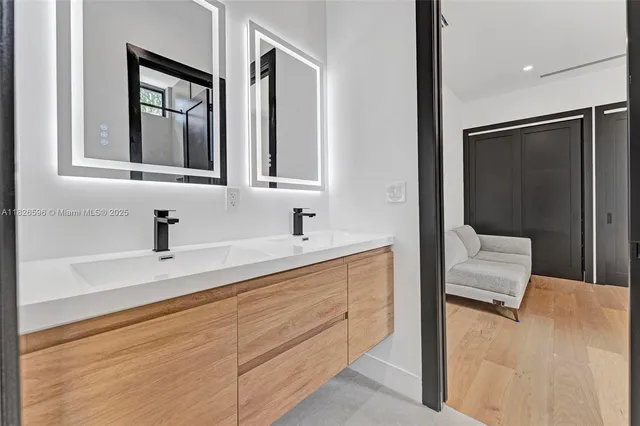 an aerial view of residential houses with outdoor space and street view