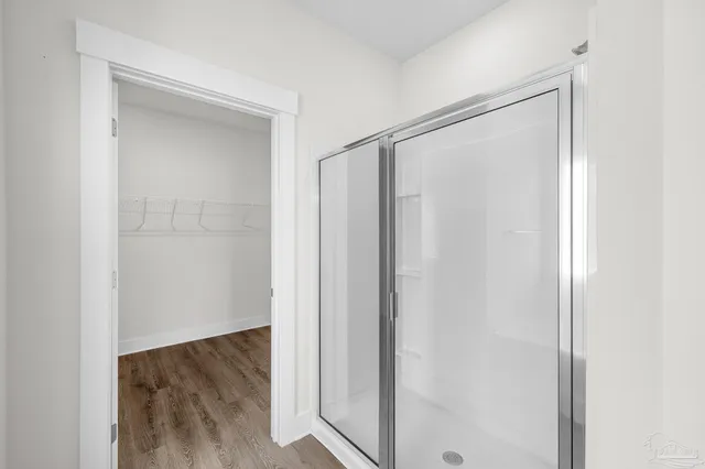 a view of bathroom with wooden floor