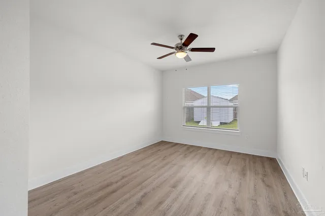 a view of room window and wooden floor
