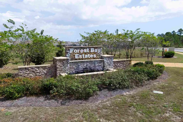 a view of a pathway with a garden