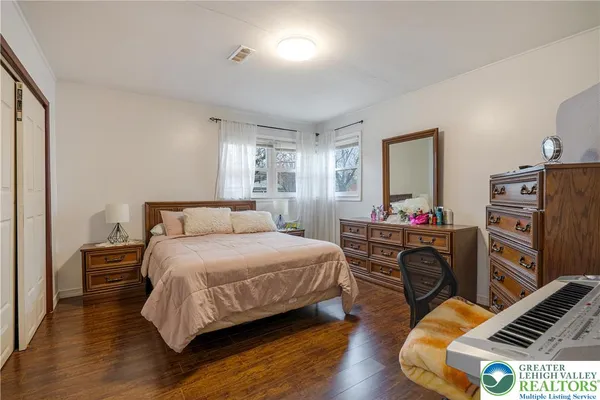 a bedroom with a bed and furniture