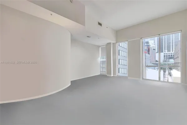 a view of an empty room with a window