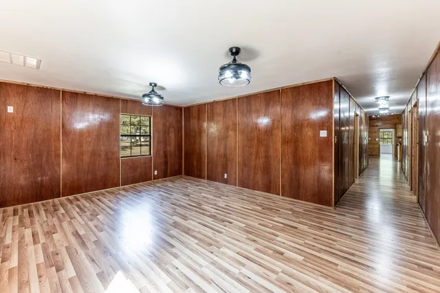 a house that has a tree in front of it