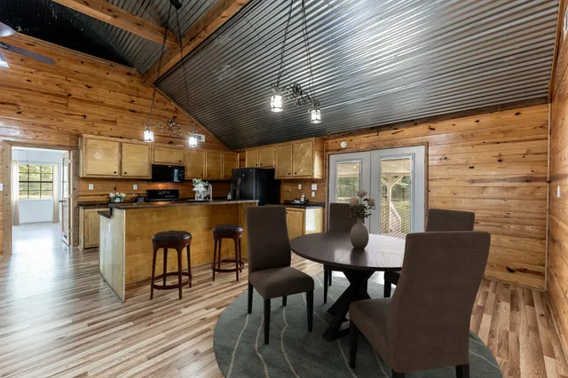 a kitchen with stainless steel appliances granite countertop a stove and a refrigerator