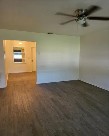 a view of a big room with wooden floor