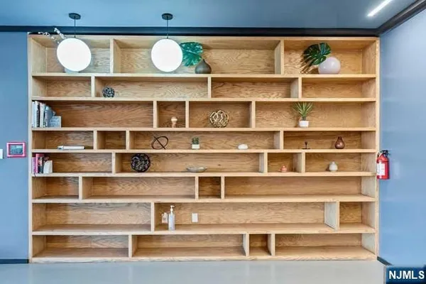 a view of a livingroom with a book shelf