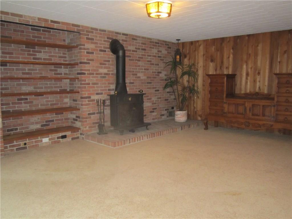 36 Churchill Road Pittsburgh, PA 15235 - Photo 23 of 25 Exposed brick, woodburning stove