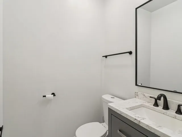 a bathroom with a toilet sink and a shower