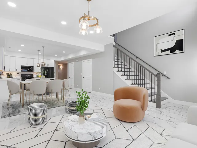 a living room with furniture and kitchen view