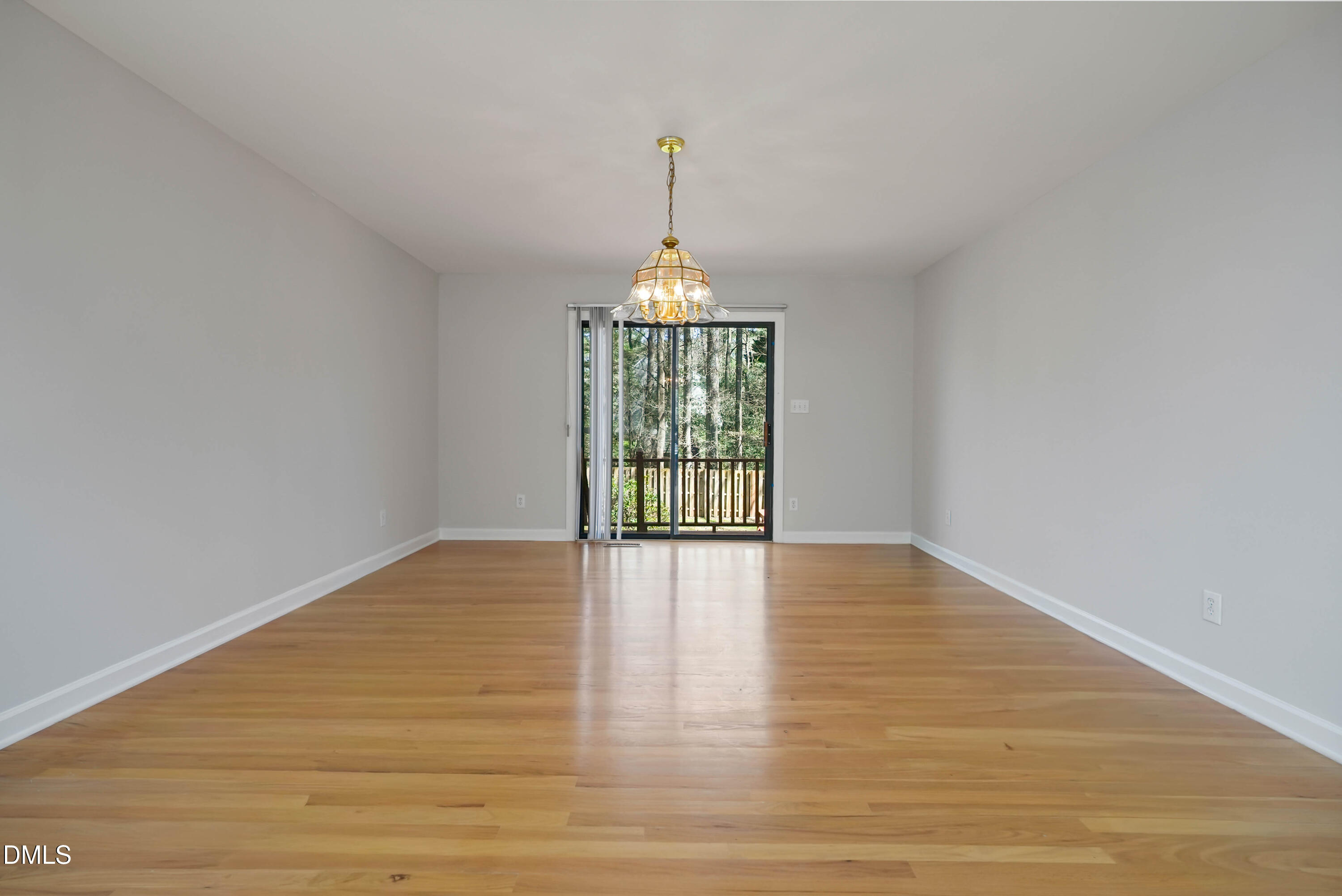 1500 Surfbird Court Raleigh, NC 27615 - Photo 11 of 47 a view of an empty room with window and wooden floor