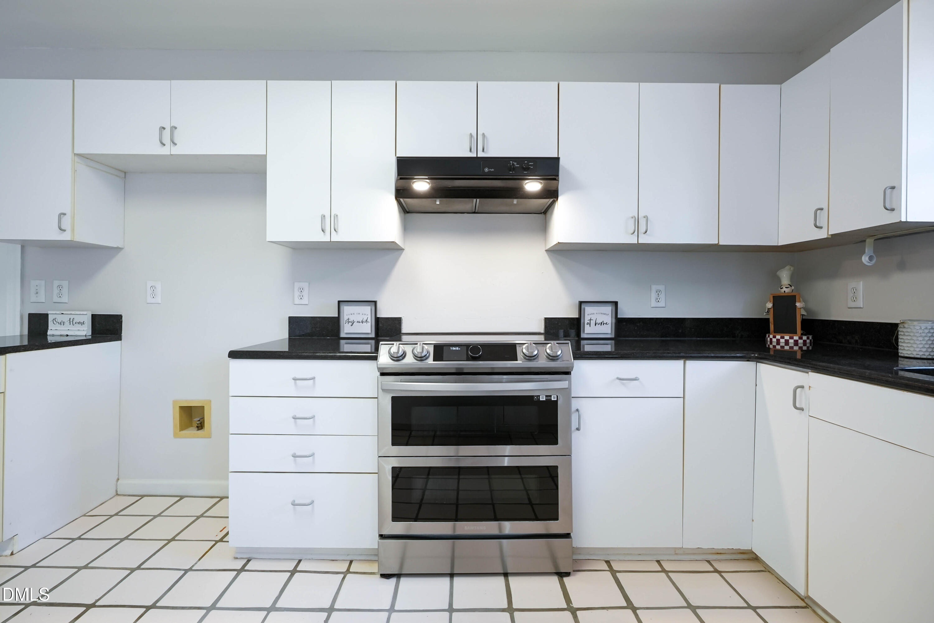 1500 Surfbird Court Raleigh, NC 27615 - Photo 13 of 47 a kitchen with a stove and a cabinets