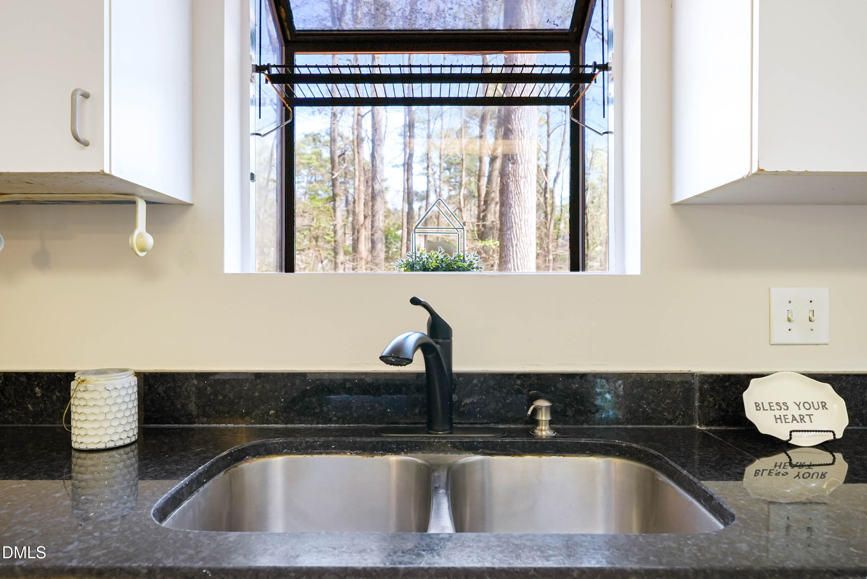 1500 Surfbird Court Raleigh, NC 27615 - Photo 15 of 47 a kitchen with a sink and a window