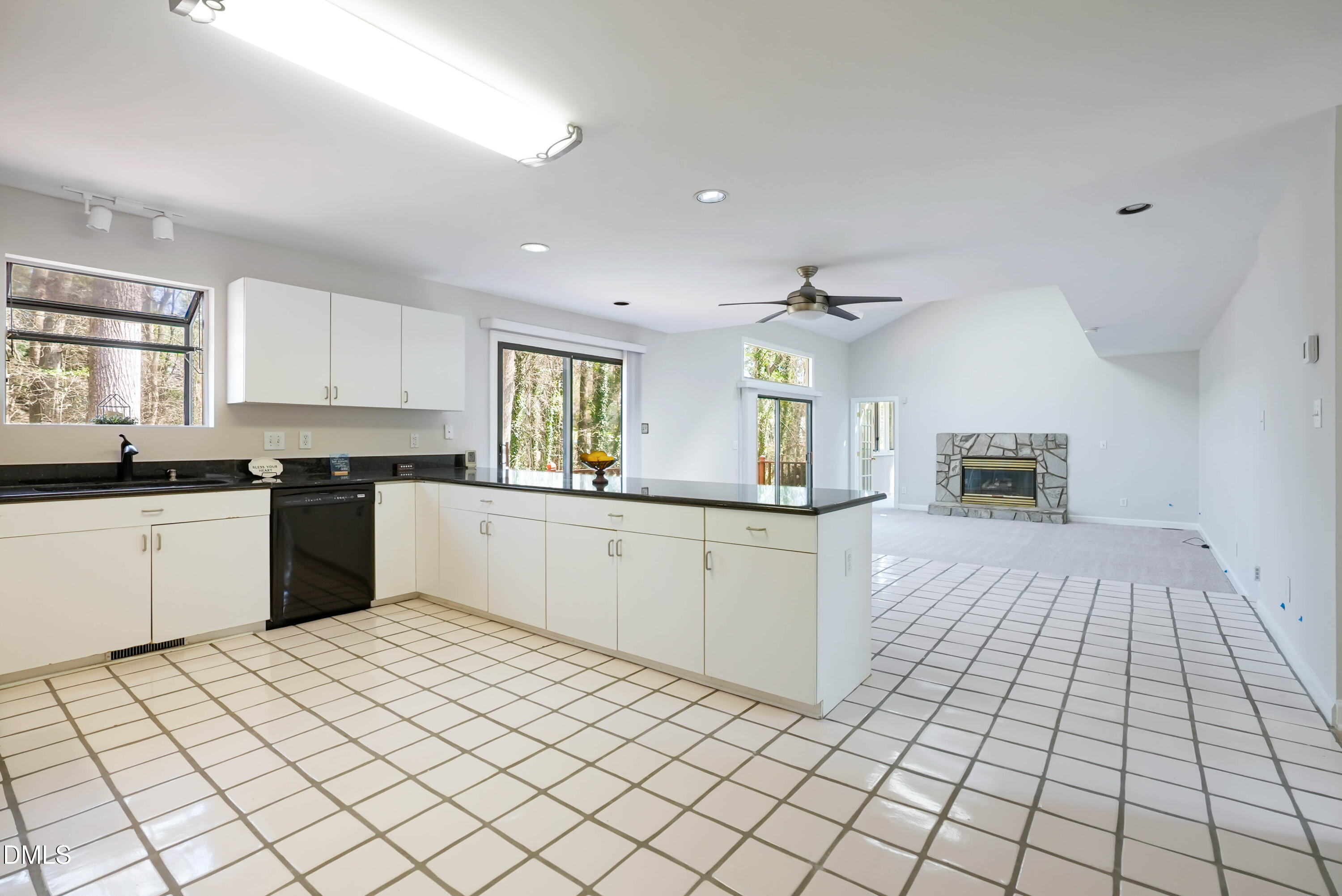 1500 Surfbird Court Raleigh, NC 27615 - Photo 19 of 47 a kitchen with a sink a counter top space and cabinets