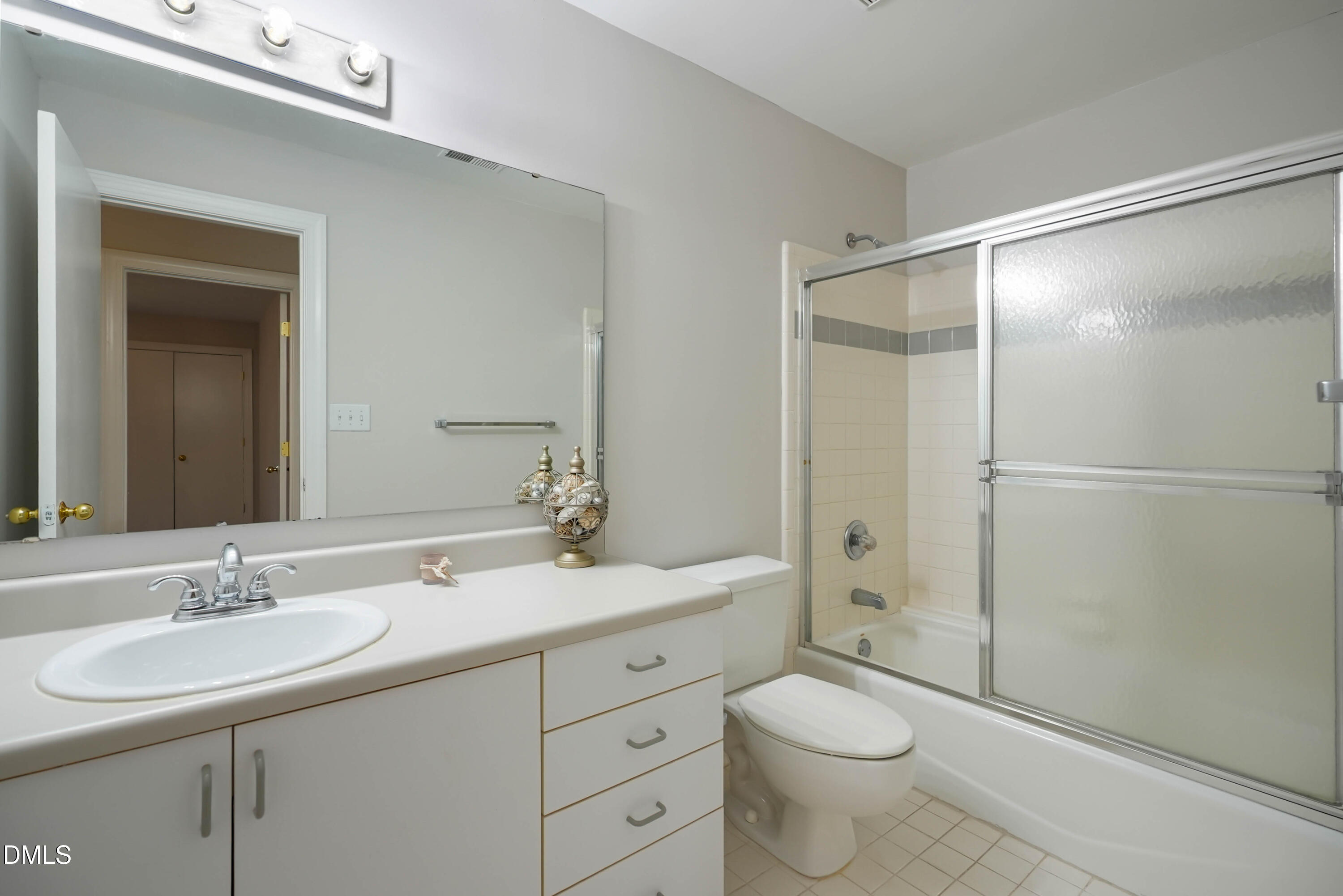 1500 Surfbird Court Raleigh, NC 27615 - Photo 29 of 47 a bathroom with a granite countertop sink toilet and shower