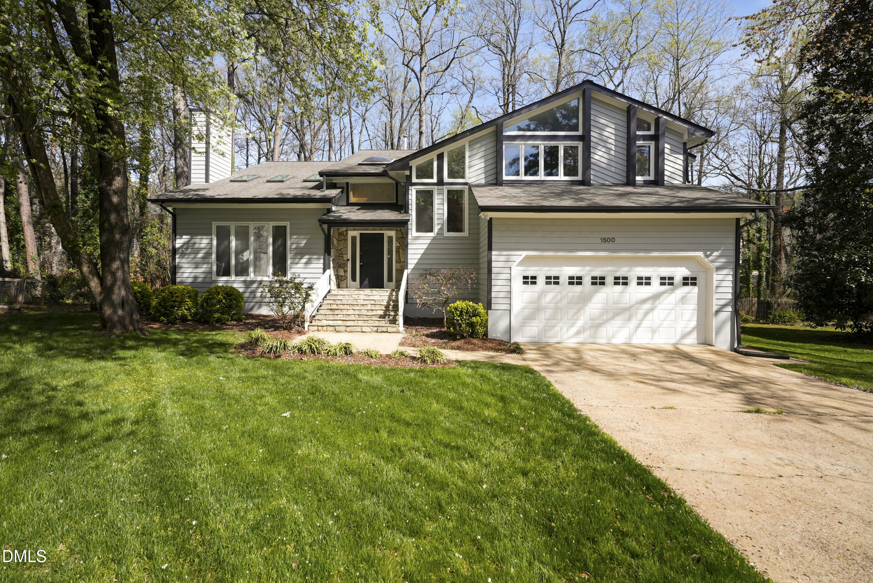 1500 Surfbird Court Raleigh, NC 27615 - Photo 3 of 47 a front view of a house with a yard