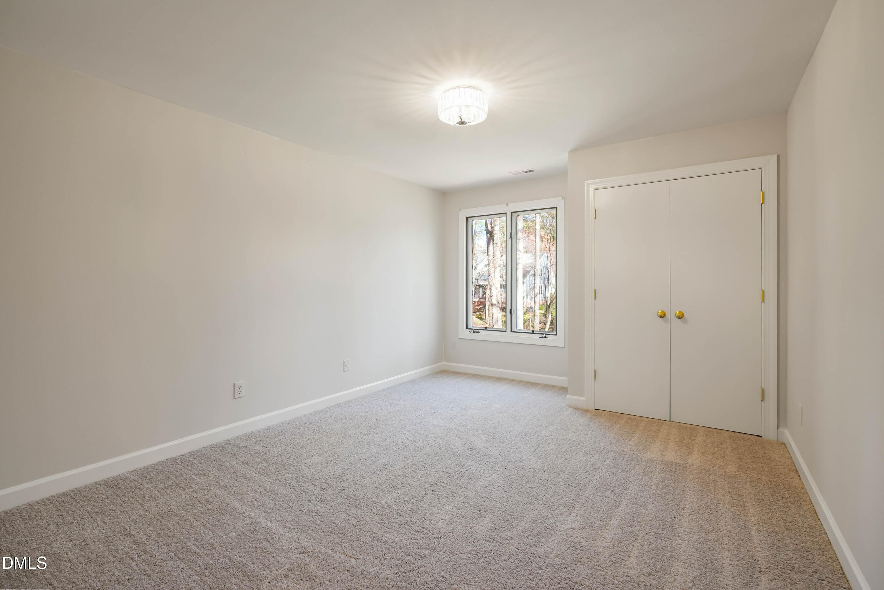 1500 Surfbird Court Raleigh, NC 27615 - Photo 32 of 47 an empty room with windows and closet