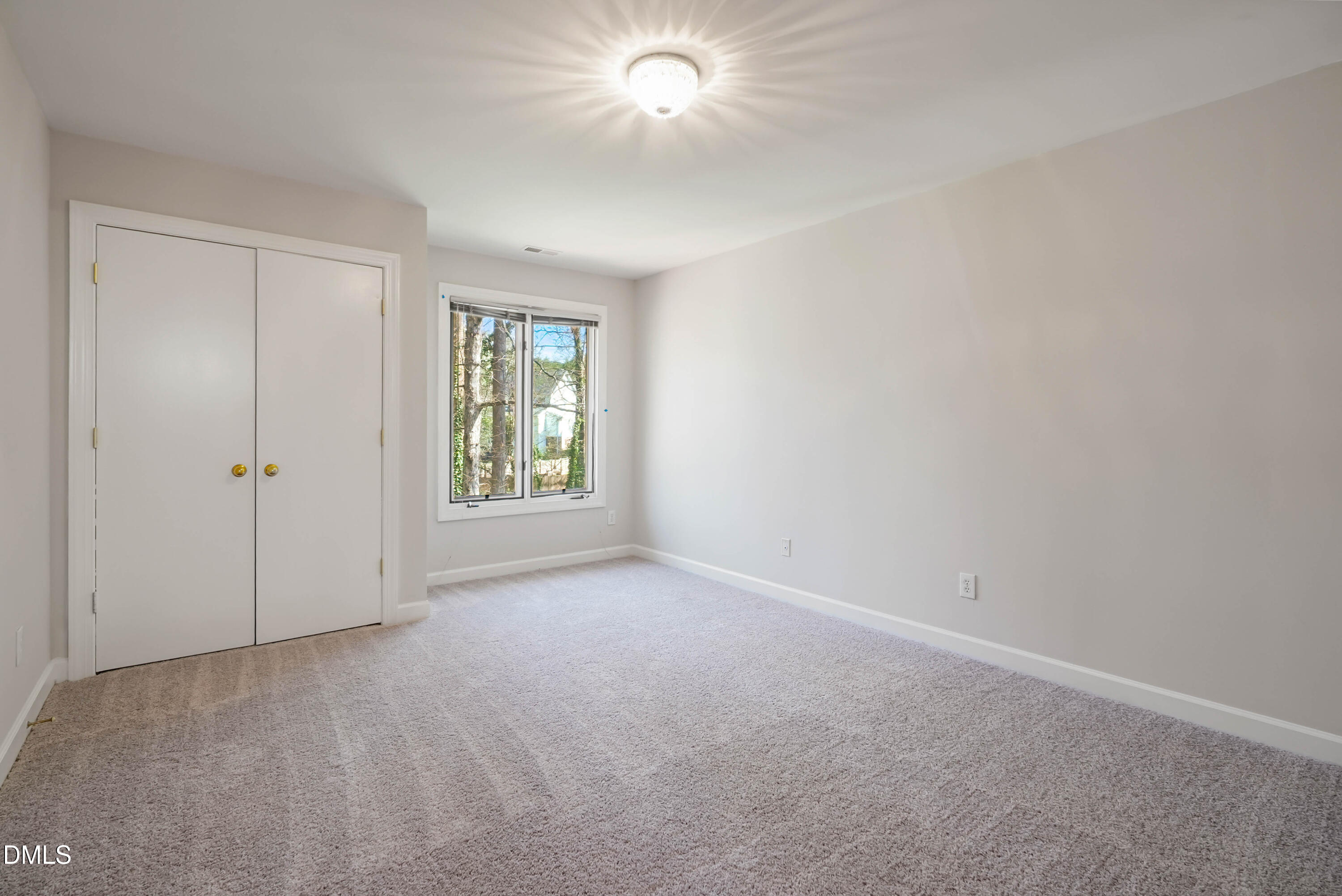 1500 Surfbird Court Raleigh, NC 27615 - Photo 33 of 47 an empty room with windows and closet