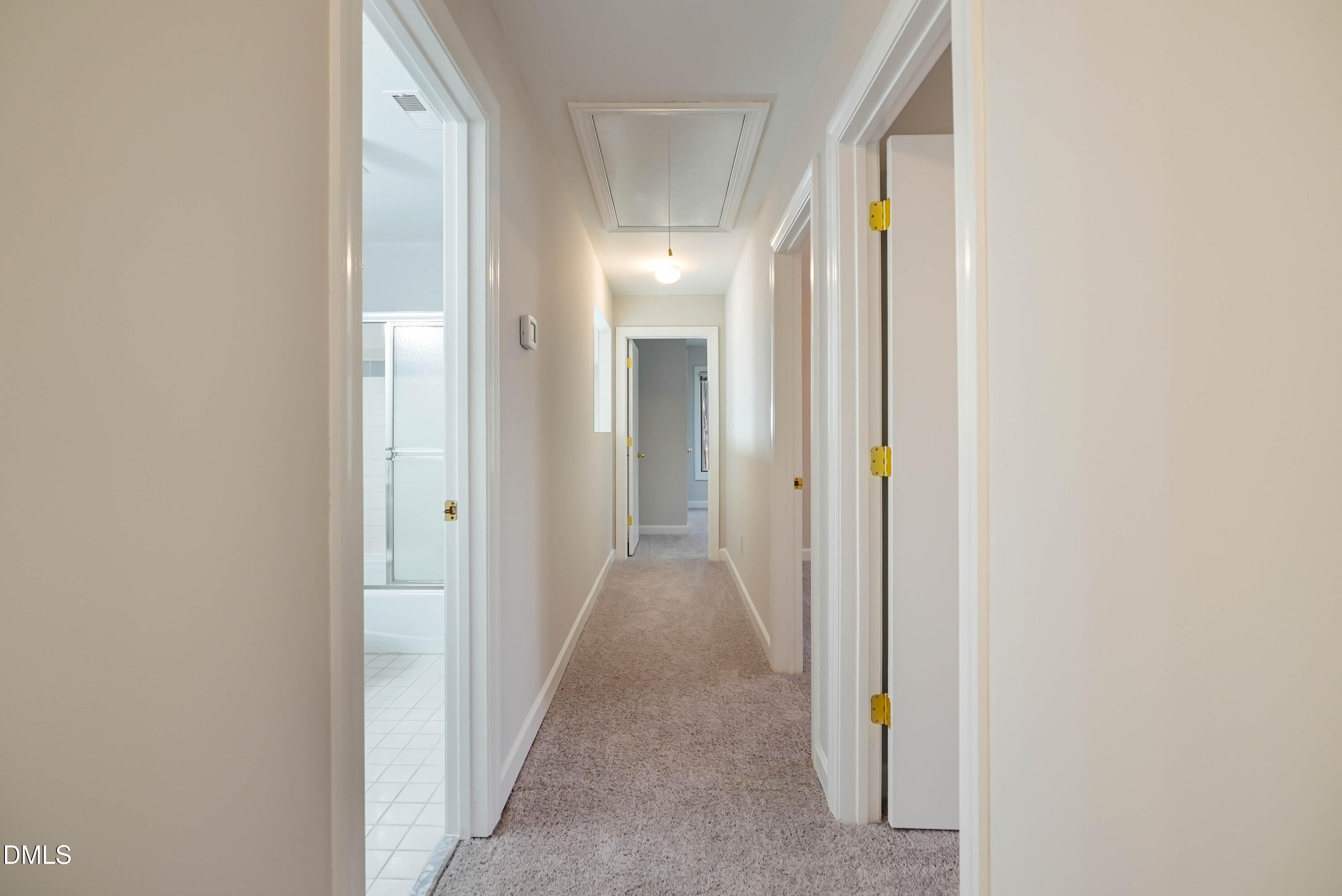 1500 Surfbird Court Raleigh, NC 27615 - Photo 34 of 47 a view of a hallway with wooden floor