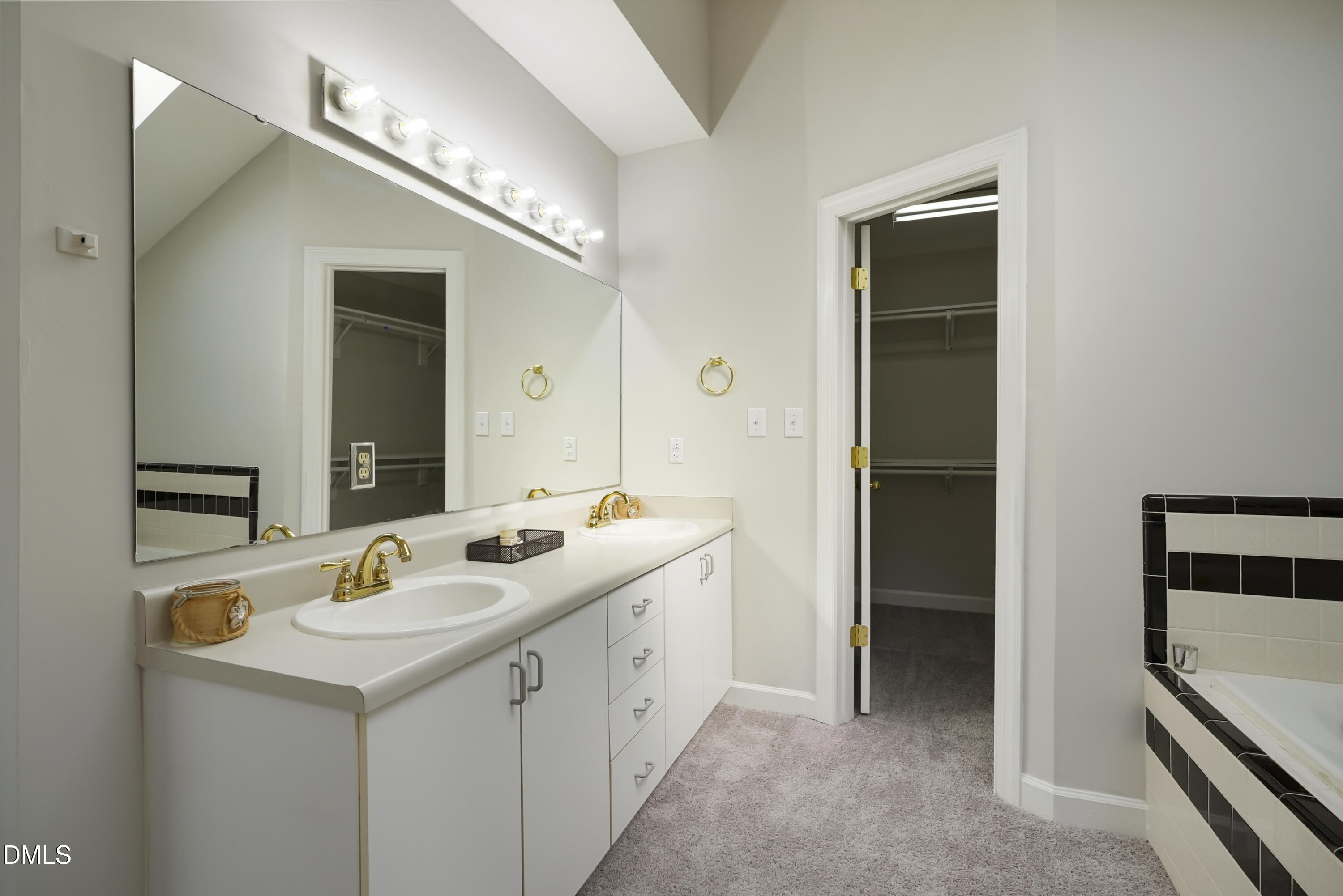 1500 Surfbird Court Raleigh, NC 27615 - Photo 37 of 47 a bathroom with a sink and a mirror