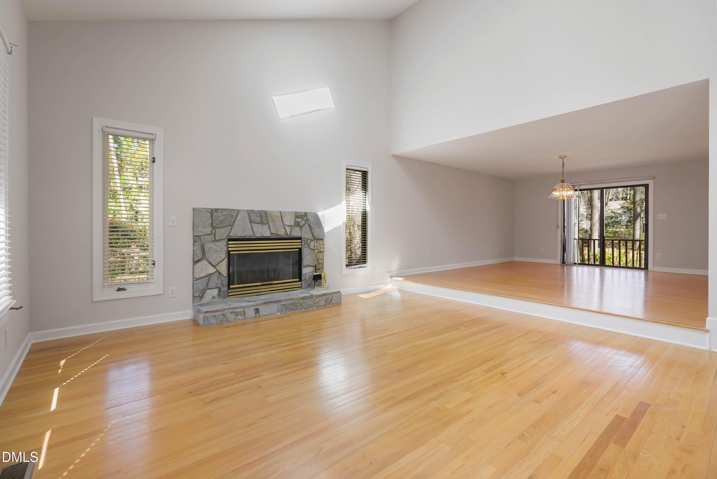 1500 Surfbird Court Raleigh, NC 27615 - Photo 7 of 47 a view of empty room with wooden floor and fireplace