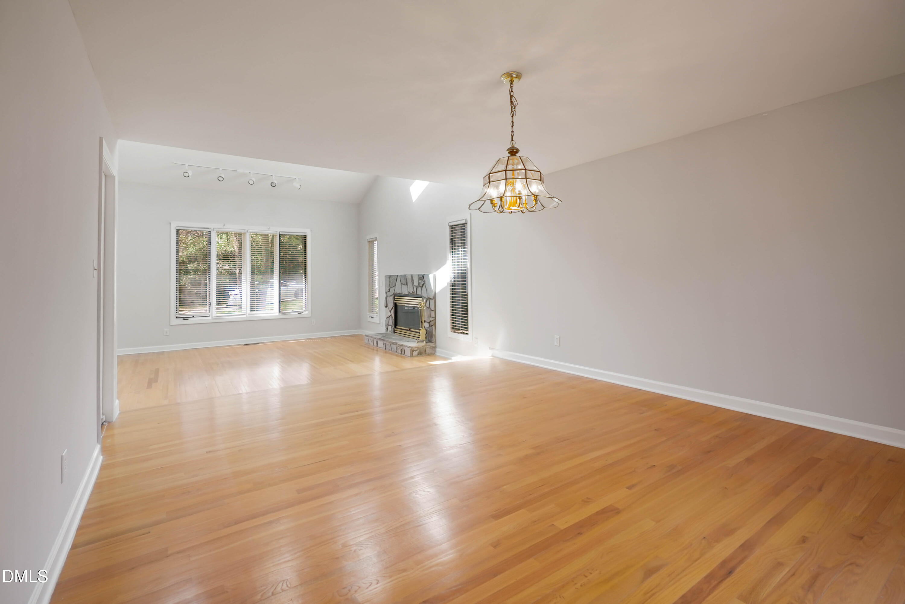 1500 Surfbird Court Raleigh, NC 27615 - Photo 8 of 47 a view of empty room with wooden floor and fan