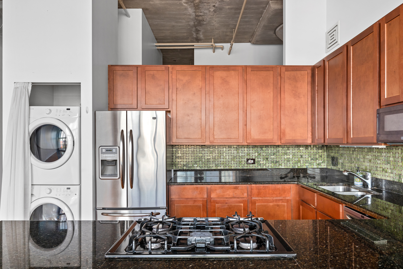 1727 South Indiana Avenue, Unit 319 Chicago, IL 60616 - Photo 11 of 21 a kitchen with blue cabinets and stainless steel appliances