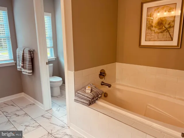a bathroom with a tub and shower