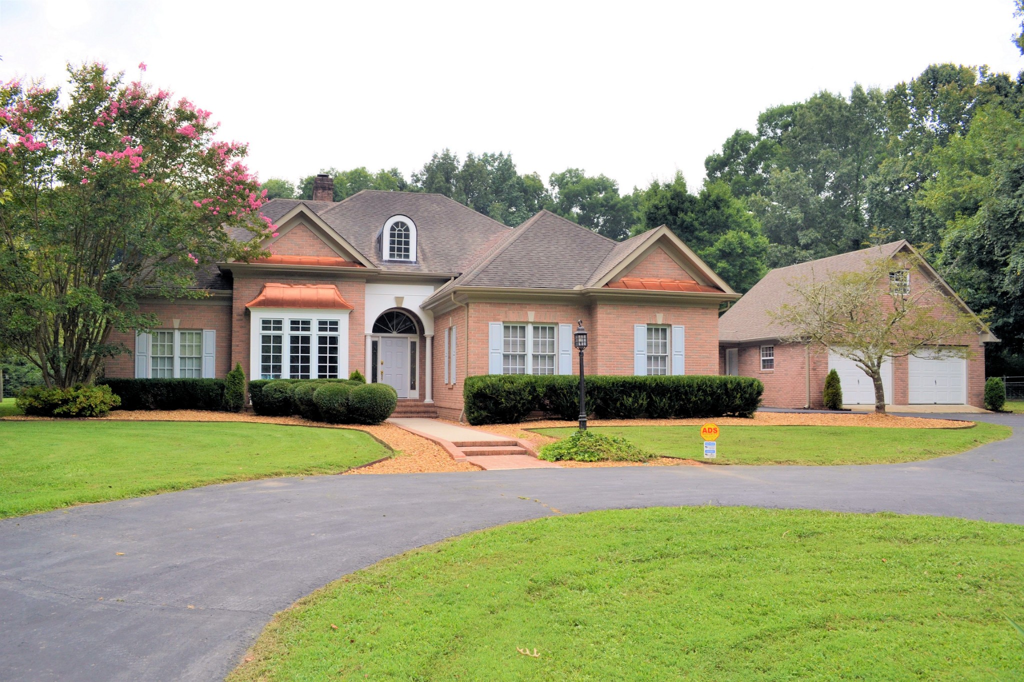 340 Shady Grove Road Flintville, TN 37335 - Photo 1 of 34 a front view of a house with a yard and garage