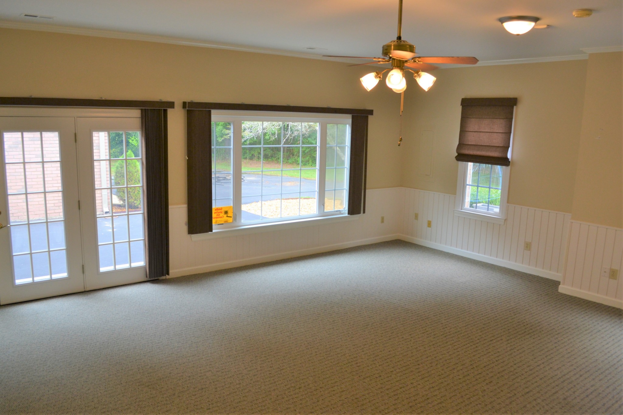 340 Shady Grove Road Flintville, TN 37335 - Photo 18 of 34 an empty room with windows and chandelier fan