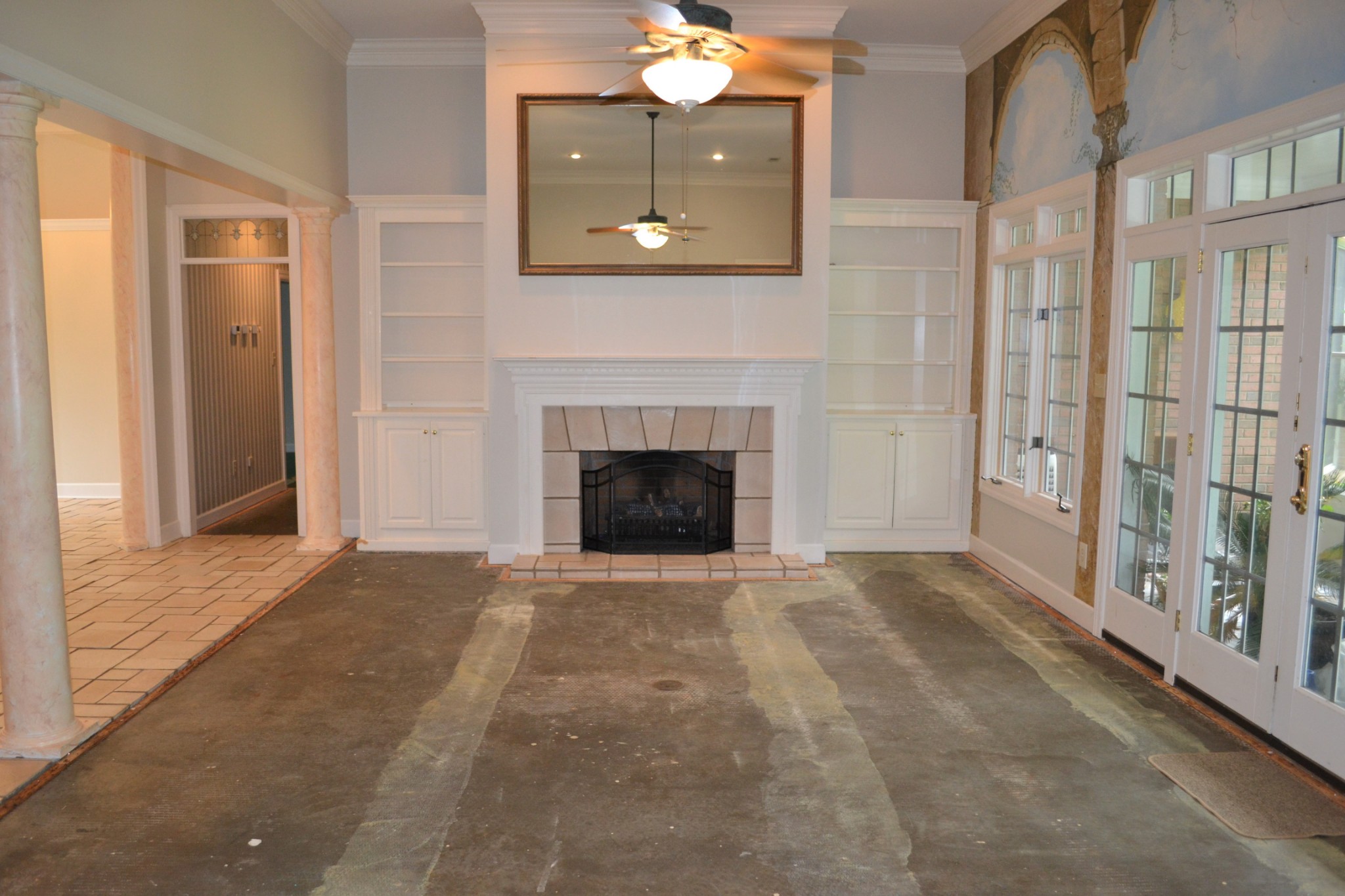 340 Shady Grove Road Flintville, TN 37335 - Photo 7 of 34 a view of an empty room with a fireplace and a window