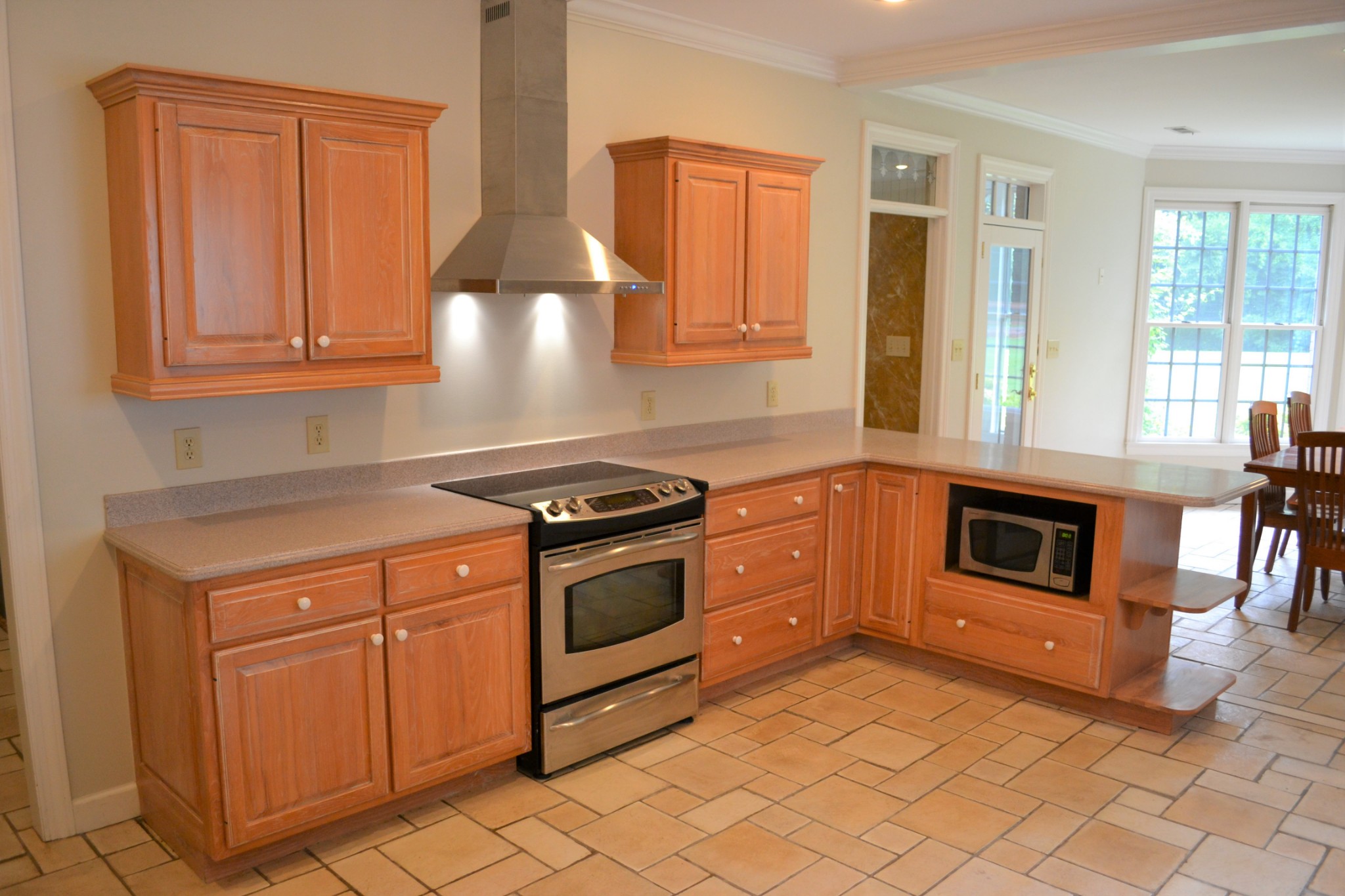 340 Shady Grove Road Flintville, TN 37335 - Photo 8 of 34 a kitchen with granite countertop a stove top oven and cabinets