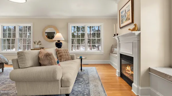 a bedroom with bed and a book shelf