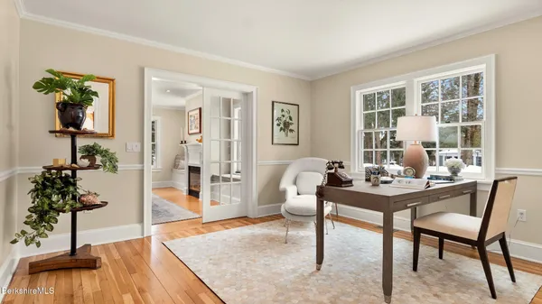 a view of a bedroom with cabinet and a window