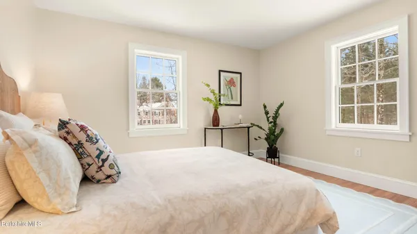 a kitchen with a sink cabinets and a window