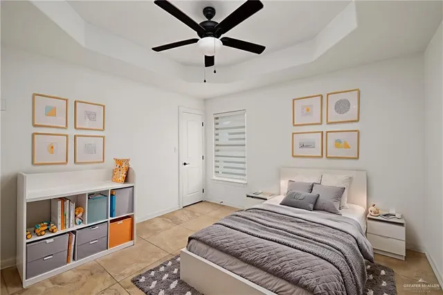 a bedroom with a bed cabinets and window