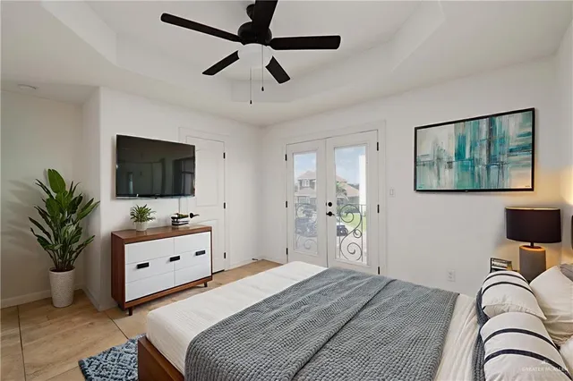 a bedroom with furniture and a flat screen tv