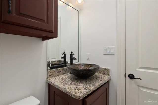 a living room with granite countertop furniture and a sink