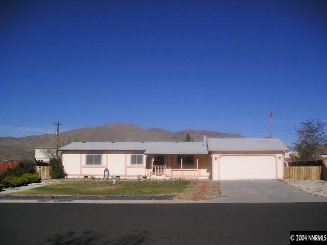 17325 Sunbird Lane Reno, NV 89508 - Photo 1 of 6 a front view of a house with a yard