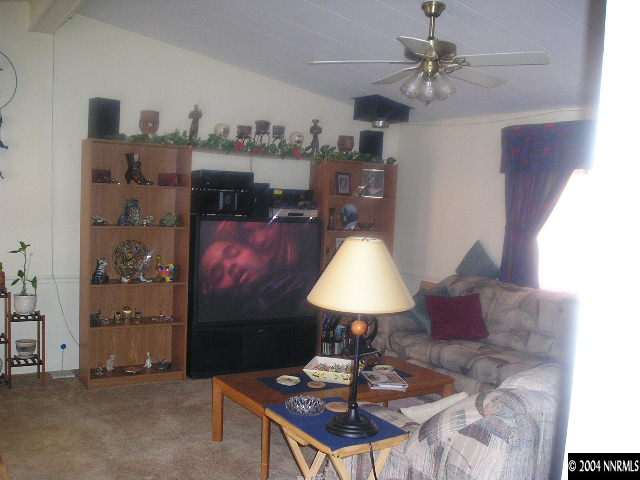 17325 Sunbird Lane Reno, NV 89508 - Photo 2 of 6 a living room with furniture and a lamp