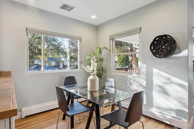 a view of a dining room with furniture window and wooden floor