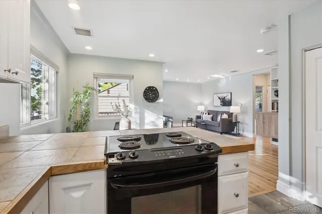 a kitchen with a stove and a sink