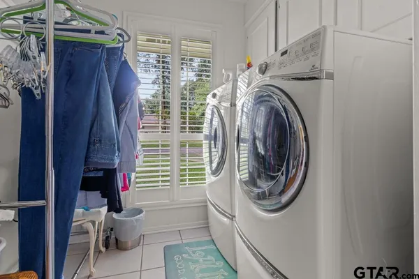 a utility room with dryer and washer