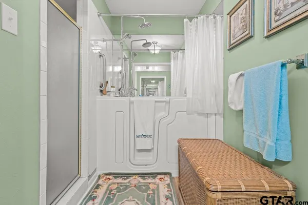 a bathroom with a sink vanity and mirror