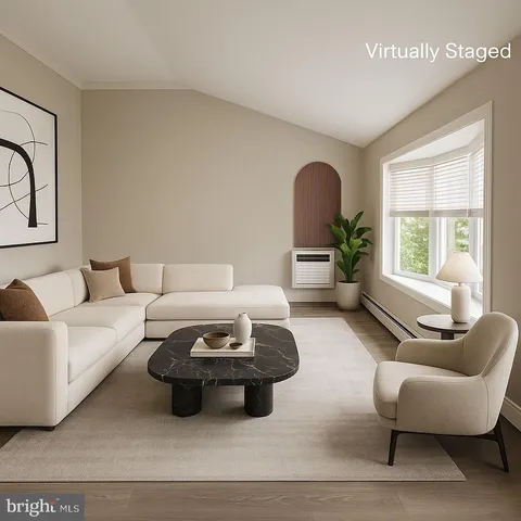 a living room with furniture and a window