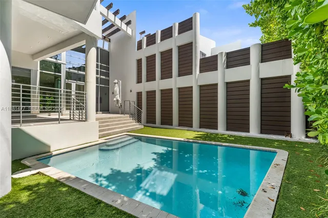 a view of a large pool with a yard