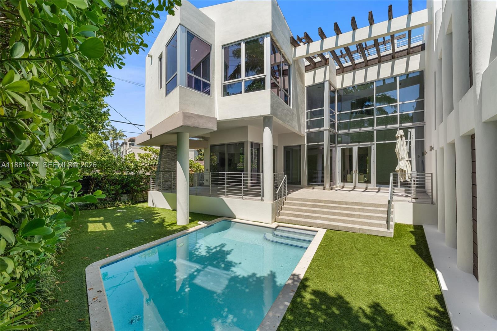 544 Fernwood Road, Unit 544 Key Biscayne, FL 33149 - Photo 11 of 35 a view of a house with a yard