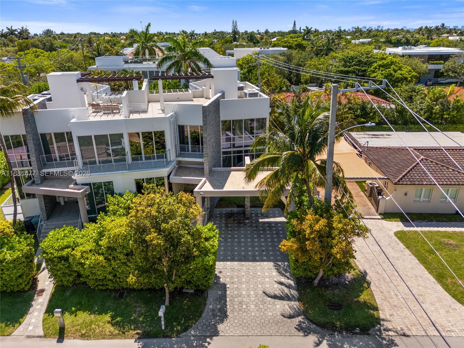 544 Fernwood Road, Unit 544 Key Biscayne, FL 33149 - Photo 18 of 35 a aerial view of a house with a garden and lake view