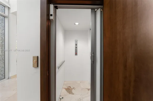 a view of a bathroom from a hallway